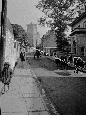 STREET SCENE WITH CHURCH